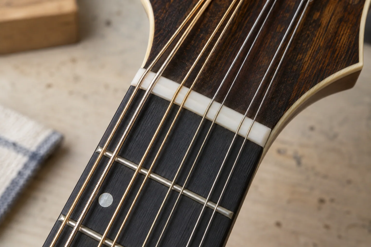 Illustrative close-up of eight-string mandolin paired courses and neck